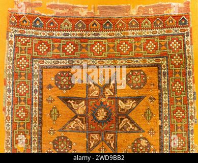 Examples of old historical Ottoman, Turkish, Middle Eastern and Iranian carpets and rugs Stock Photo