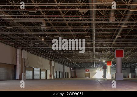 Empty and dark large warehouse. factory warehouse, interior view storage and logistics Stock Photo