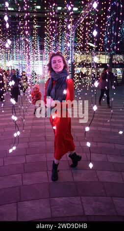 London, UK, 17th January 2024, Winter Lights at Canary Wharf opened for its 8th edition. Light installations are around the area for people to explore. It's free; it opened on the 17th till 27th January 2024. Julia a model from Norway was enjoying the lights on a very cold night, this art installation is called Submergence by Squidsoup., Andrew Lalchan Photography/Alamy Live News Stock Photo