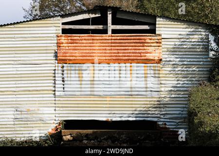 Rusted tin shed for agricultural use, rural Monmouthshire, Wales UK Stock Photo
