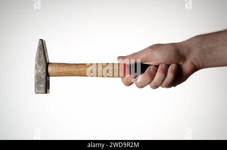 Hammer in mans hand on white background. Stock Photo