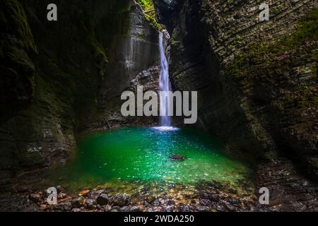 Picturesque waterfall in the Soca valley, Slovenia. Kozjak waterfall in the deep mountain canyon in Triglav national park. Stock Photo