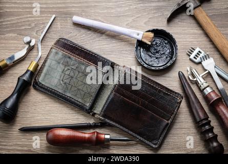 Concept of handcrafted leather goods. Production of genuine leather. Handcrafted tools. Genuine leather design Stock Photo