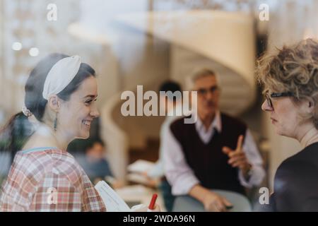 Businesspeople discussing innovative solutions for successful teamwork in an international corporate office. Stock Photo