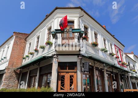 253 Two-storey building at Sheshi Iliria Square and Rruga Naum Kristo Voskopja street corner, Old Bazaar -Pazari i Vjeter- area. Korca-Albania. Stock Photo