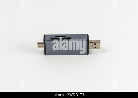 Small USB hub with two ports USB-A and SD and microSD cards slots and is compatible with USB-C Stock Photo