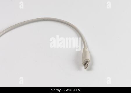 Long white cable with Lightning connector at the end for iPhone chargers Stock Photo