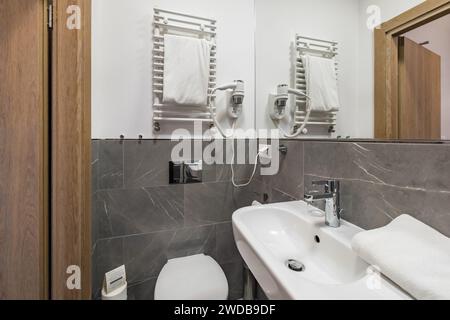 Gdansk, Poland - September 6 2023: Interior of hotel room for single and toilet of Impresja 3 star hotel at Aniolki district of Gdansk city Stock Photo