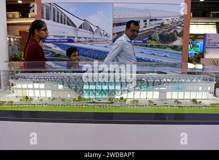 Ahmedabad, Gujarat, India. 13th Jan, 2024. Visitors walk past a miniature of bullet train railway station kept on display at Vibrant Gujarat Global Trade Show in Ahmedabad. Vibrant Gujarat Global Trade Show is a platform to bring Indian and International investors to invest in the state thereby creating business and employment opportunities for thousands of people and strengthening the economy. (Credit Image: © Ashish Vaishnav/SOPA Images via ZUMA Press Wire) EDITORIAL USAGE ONLY! Not for Commercial USAGE! Stock Photo