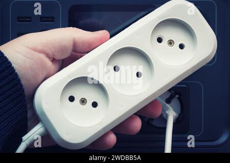 Electrical Extension Tee For Socket. Blackout Energy Supply With Charging Station. Electricity Household Equipment, Selective Focus. Stock Photo