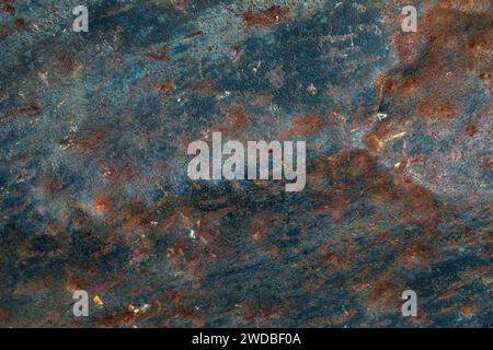 Flat background of old metal sheet with worn paint and traces of corrosion Stock Photo