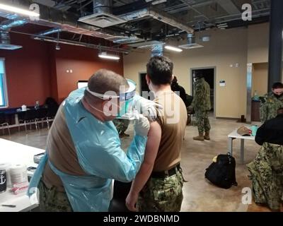 210216ZZ999-001 Sailors assigned to Naval Support Facility (NSF) Redzikowo, Poland receive their first dose of the Moderna COVID-19 vaccine. Stock Photo