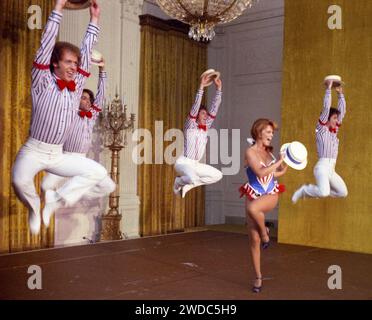 Photograph of Ann-Margret and Back-up Dancers Performing during the Entertainment Portion of a State Dinner Honoring the Shah of Iran - Stock Photo