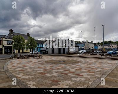Empty town square with cobblestones, surrounded by buildings under a cloudy sky, Perceval Square in Stornoway. Isle of Harris & Lewis. Outer Stock Photo