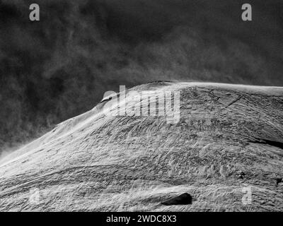 A black and white image of a mountain ridge with strong texture and high contrasts, Mont Blanc. Chamonix Stock Photo