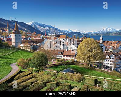 View from the rose garden at the Guggi to the Zytturm, Capuchin tower and church, old town, behind Rigi, Pilatus, Zug, Canton Zug, Switzerland Stock Photo