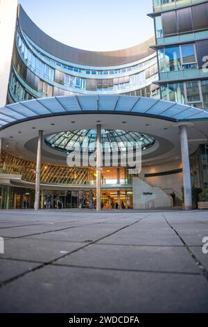 Modern office building with glass facade and curved canopy in the entrance area, City Plaza, Stuttgart, Germany Stock Photo