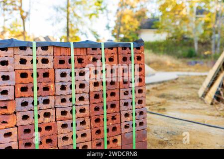 Stack of bricks for home construction with copy space Stock Photo