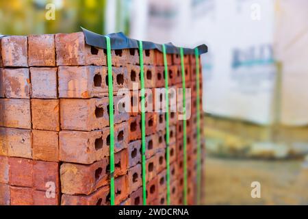 Stack of bricks for home construction with copy space Stock Photo