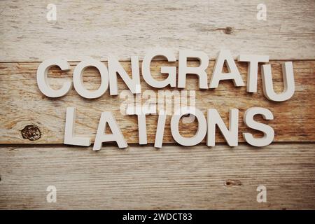 Congratulations alphabet letters on wooden background Stock Photo