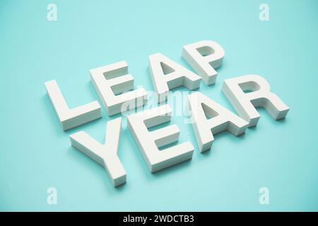 Leap Year alphabet letter with space copy on blue background Stock Photo