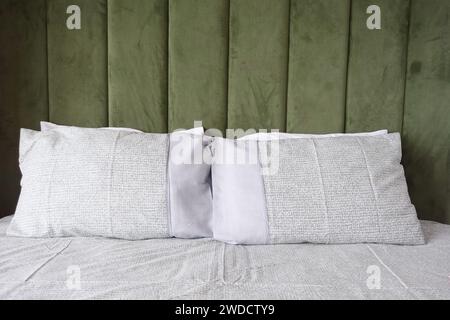 white pillow lined up on bed  Stock Photo