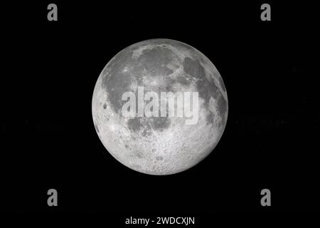Isolated glowing moon on black background. Shadow passes across the moon Stock Photo