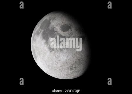 Isolated glowing moon on black background. Shadow passes across the moon Stock Photo