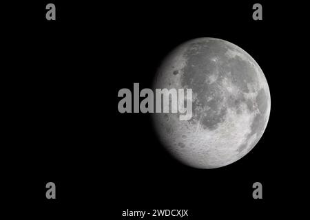 Isolated glowing moon on black background. Shadow passes across the moon Stock Photo