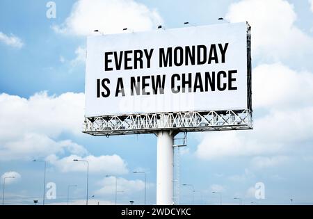 Every Monday is a new chance text message on signboard with blue sky Stock Photo