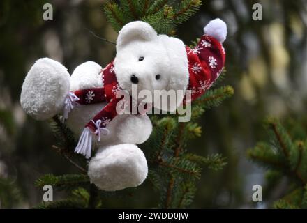 Santa teddy bear on the facade of a rural house in the picturesque village of Barr in Alsace, France. Stock Photo