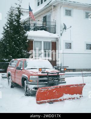 A truck with snow plow in the snow, Buffalo, New York Stock Photo