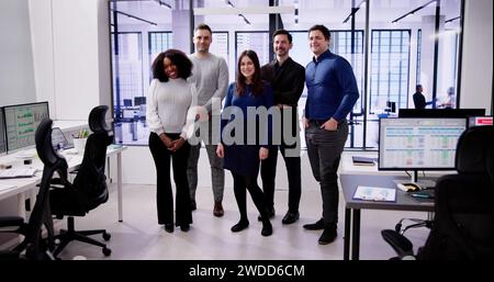 Happy Group Of Business People Standing In Office Stock Photo