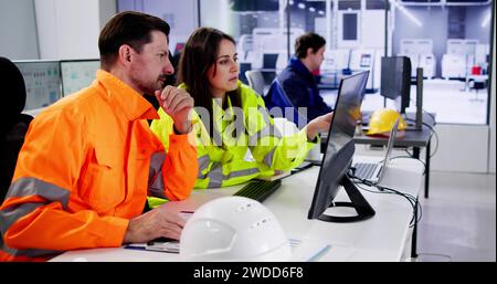 Engineer Operators Using Scada System At Industrial Plant Stock Photo