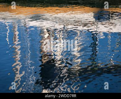 Reflections of boats in Tarbert Harbour, Loch Fyne, Argyll, Scotland Stock Photo
