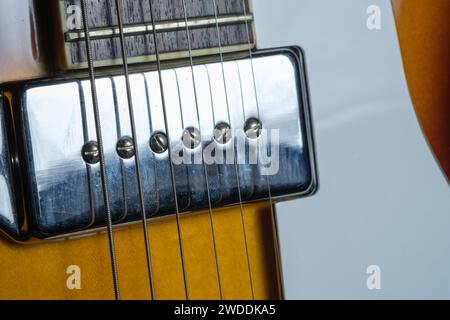 Electric guitar pick up with strings and pick guard Stock Photo