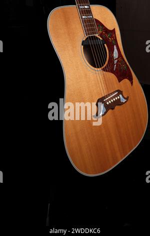 Acoustic Guitar body with fretboard and scratch plate and strings Stock Photo