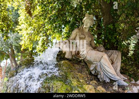 Temple of Aesculapius, Villa Borghese Lake. Water fountain statue detail. Rome, Italy Stock Photo