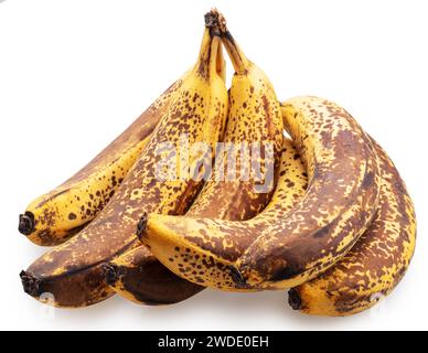 Bunch of overripe bananas with black spots on white background. File contains clipping path. Stock Photo