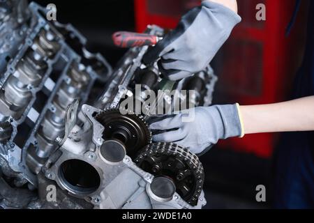 Master uses special tools to repair engine of modern car Stock Photo