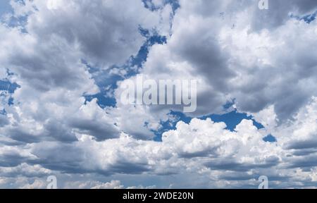 Stunning skyscape with cumulus clouds. Cloudy sky panorama. Stock Photo