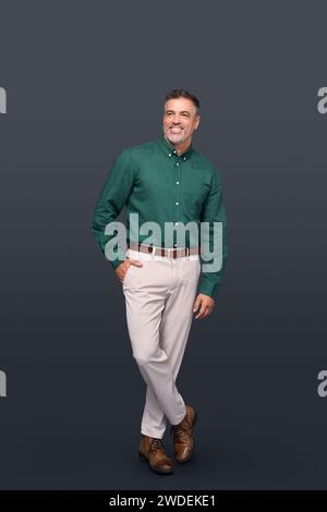 Happy middle aged stylish business man isolated on gray background, full length. Stock Photo