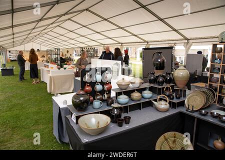 UK, England, Warwickshire, Compton Verney House, Potfest ceramics event, exhibitors in marquee Stock Photo