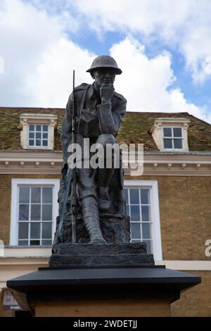 The War Memorial showing 'The Thinking Soldier' in Market Square, Huntingdon, Cambridgeshire Stock Photo