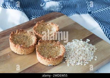 Homemade recipe made with oat flakes and natural yogurt filling, berries. Delicious and healthy breakfast snack preparation Stock Photo