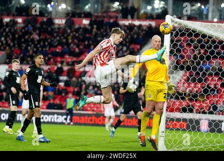 Stoke City's Nathan Lowe (left) and Birmingham City goalkeeper John Ruddy battle for the ball during the Sky Bet Championship match at the bet365 Stadium, Stoke. Picture date: Saturday January 20, 2024. Stock Photo