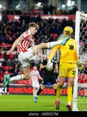 Stoke City's Nathan Lowe (left) and Birmingham City goalkeeper John Ruddy battle for the ball during the Sky Bet Championship match at the bet365 Stadium, Stoke. Picture date: Saturday January 20, 2024. Stock Photo