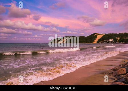 Colorful Sunset Sky at Ponta Negra Beach in Natal City, Brazil Stock Photo