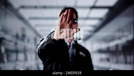 Security Guard Officer Making Stop Gesture In Office Stock Photo