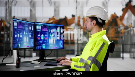 Men In Automotive Car Factory Using Scada System Stock Photo